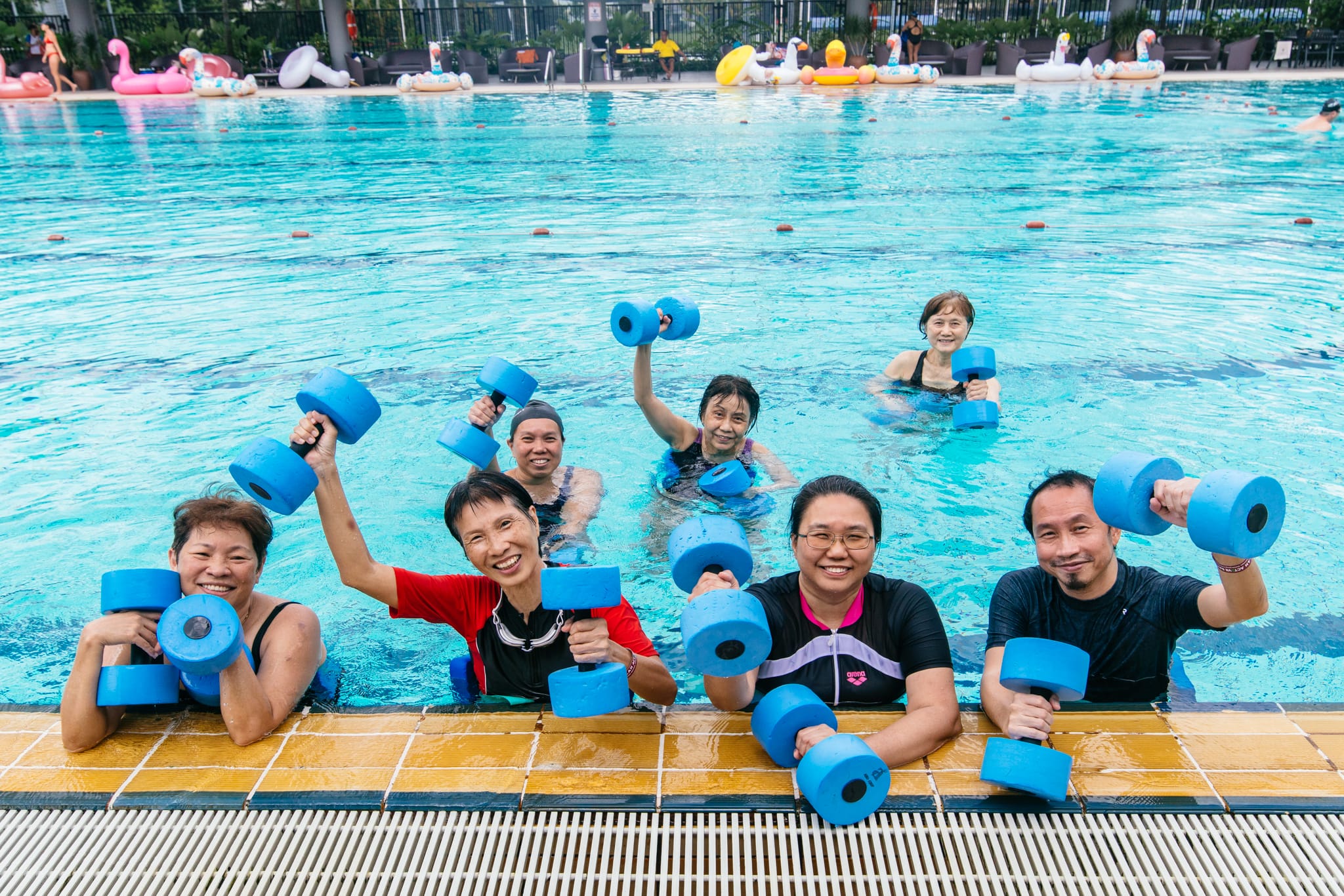 People having fun aqua aerobics in the swimming pool